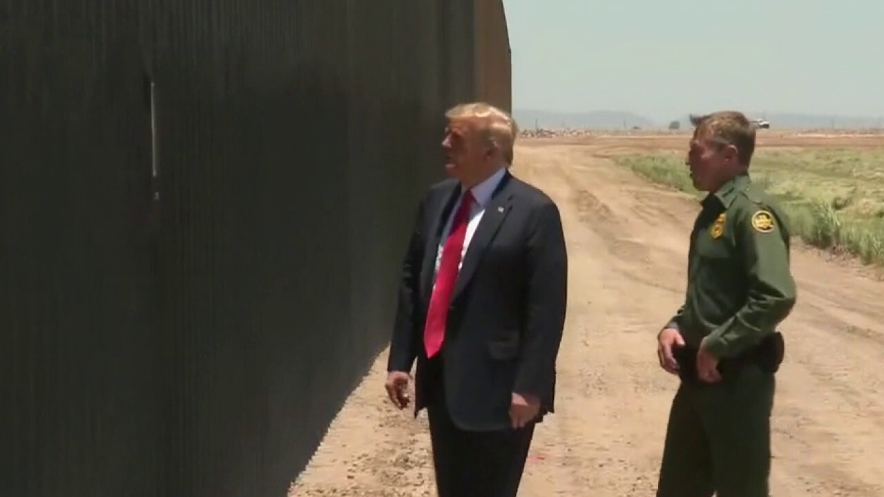 President Trump shifts focus to border security, tours border wall in Arizona