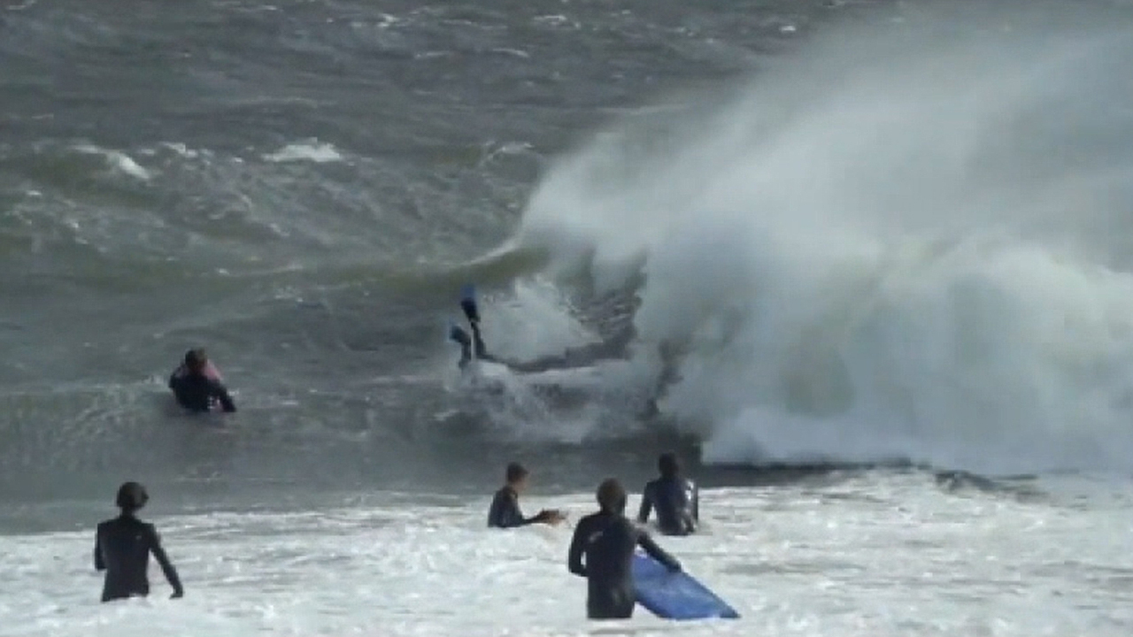 Surfers brave huge waves off Sydney coast despite warnings of hazardous conditions