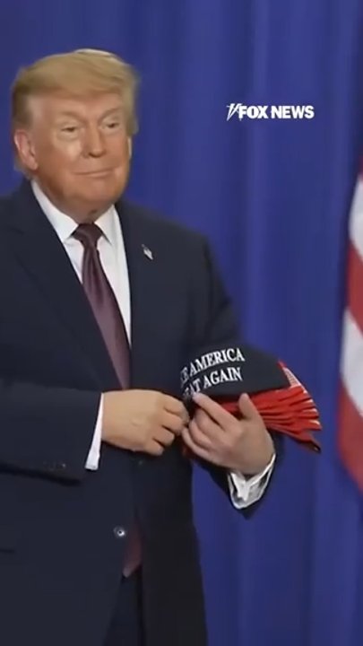 Trump tosses MAGA hats into crowd at rally