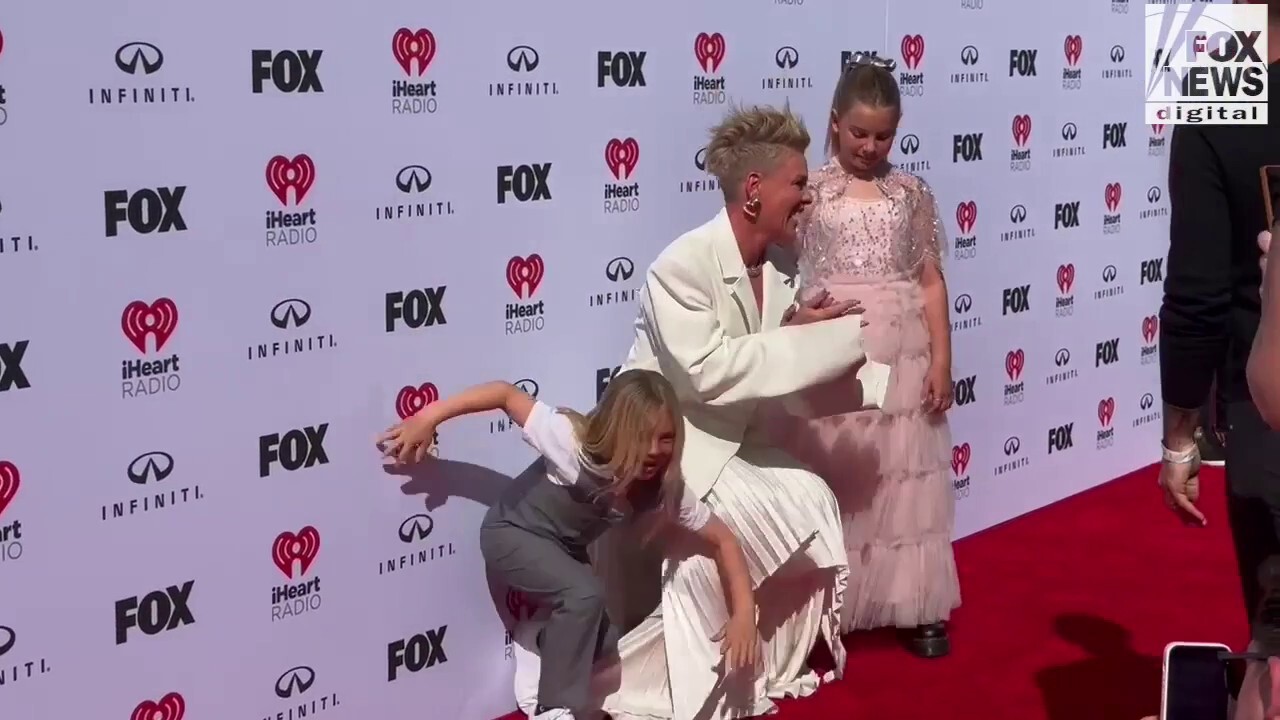 Pink walks the iHeartRadio Music Awards red carpet with her children