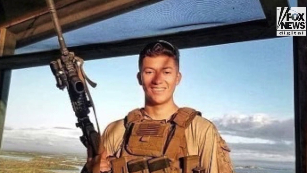 HEROES OF KABUL: Cpl. Hunter Lopez dove into a sea of people to save girls fleeing the Taliban