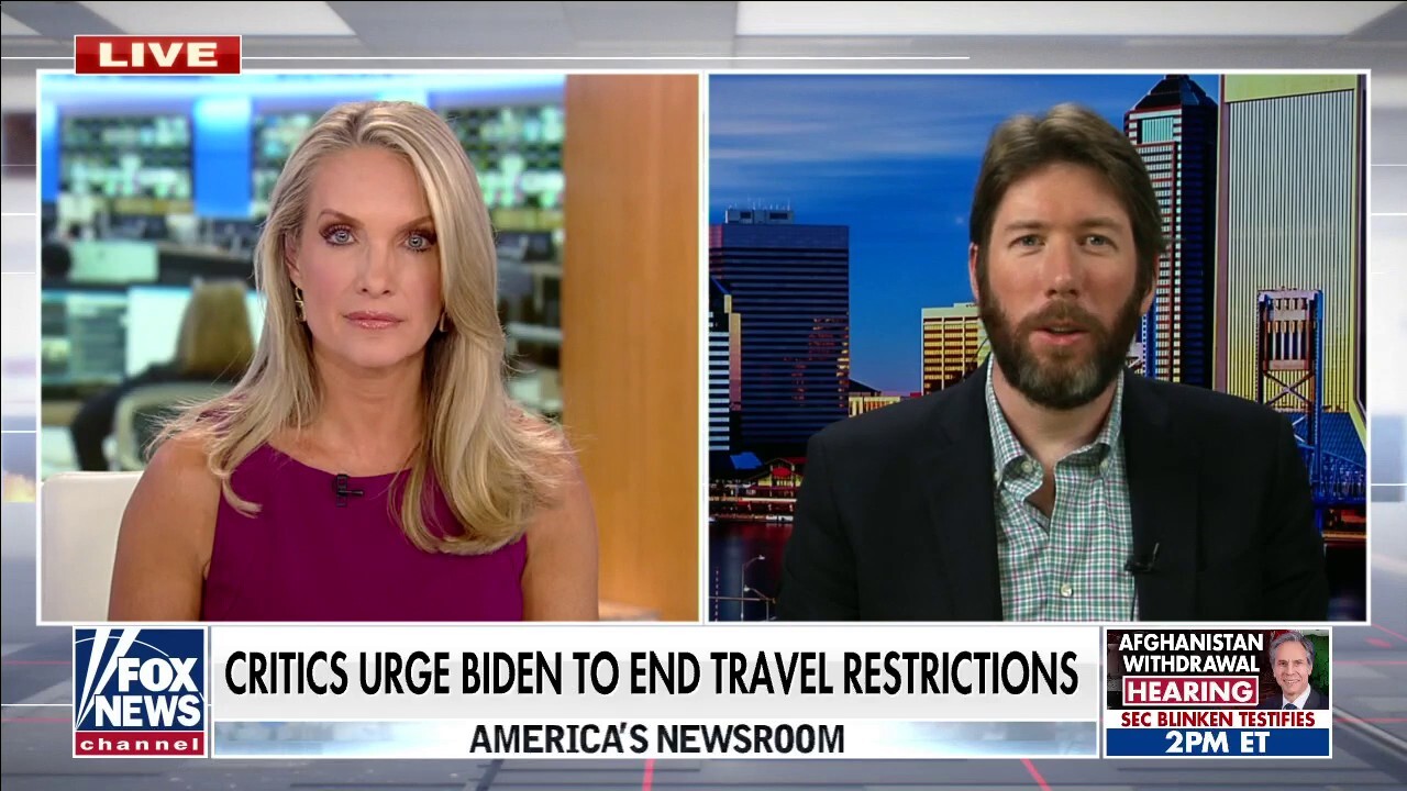 Critics urge Biden to end travel restrictions