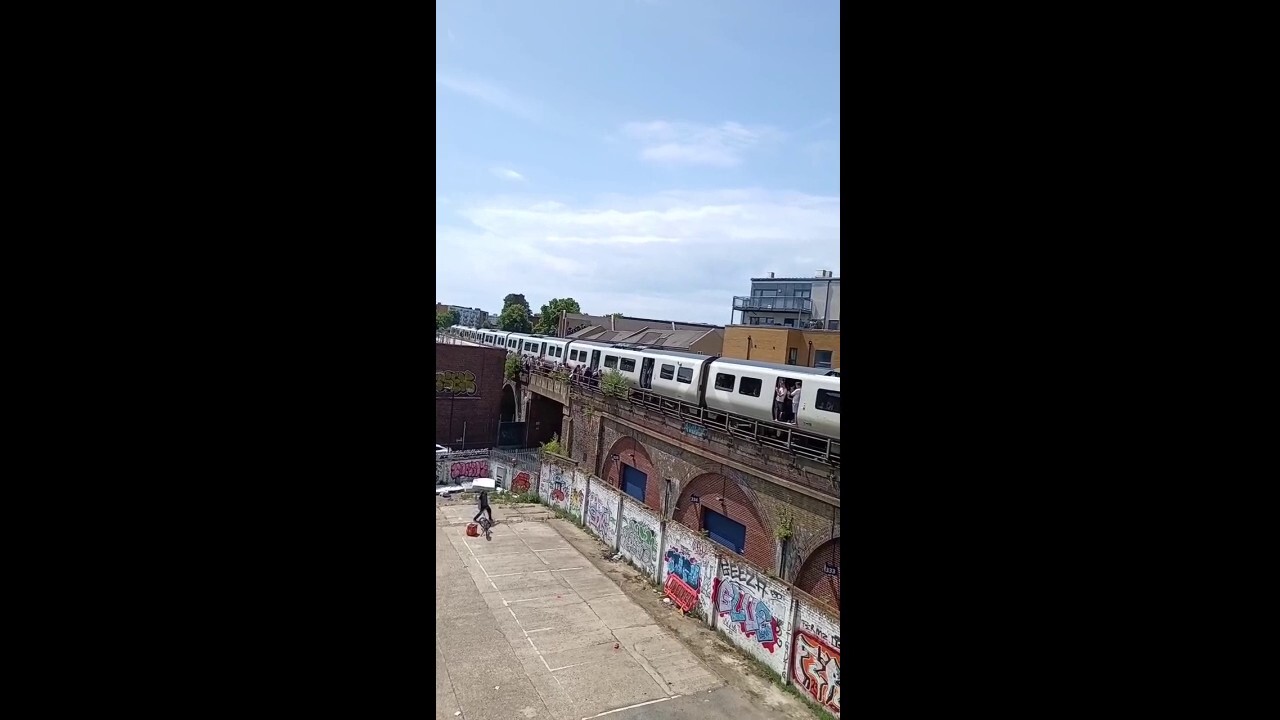 Passengers stuck on hot train receive gift from delivery driver