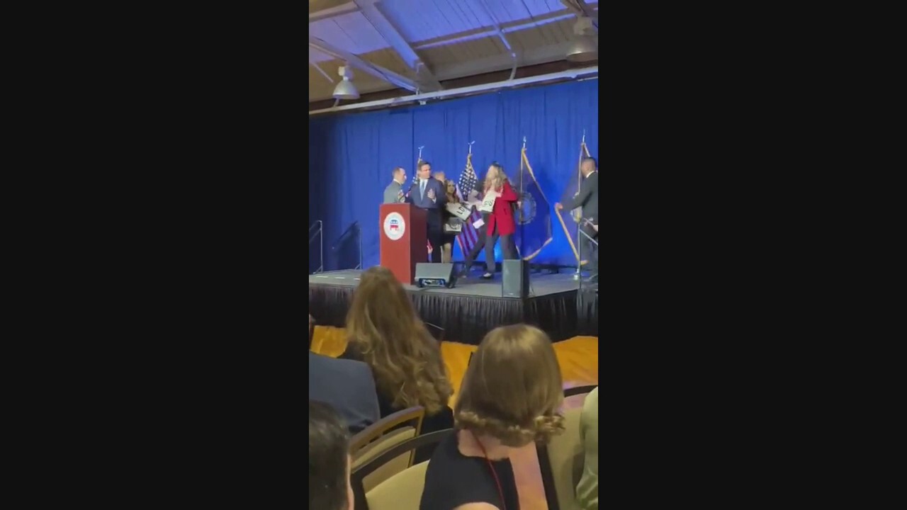 DeSantis protesters rush stage during New Hampshire speech