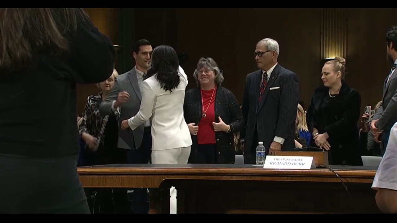 Tulsi Gabbard receives a round of applause upon the conclusion of her hearing