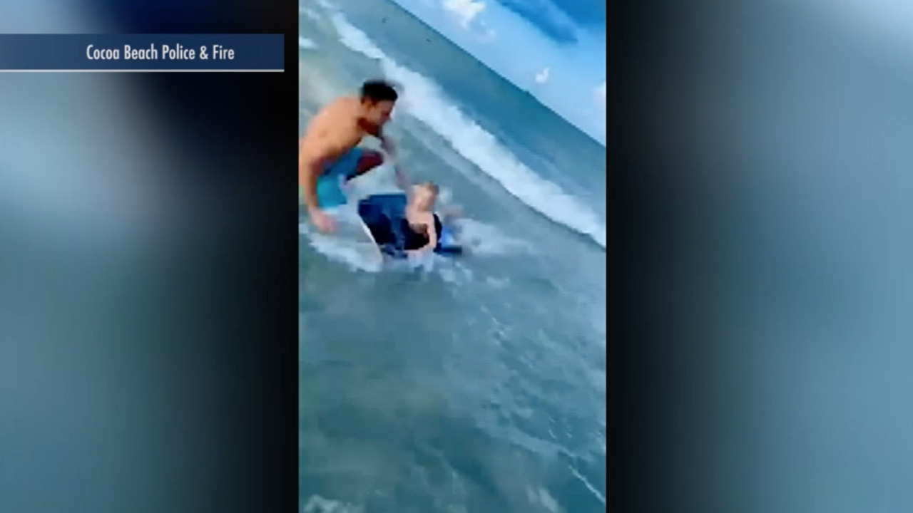 Raw video: Off-duty Florida officer pulls boy away from nearby shark