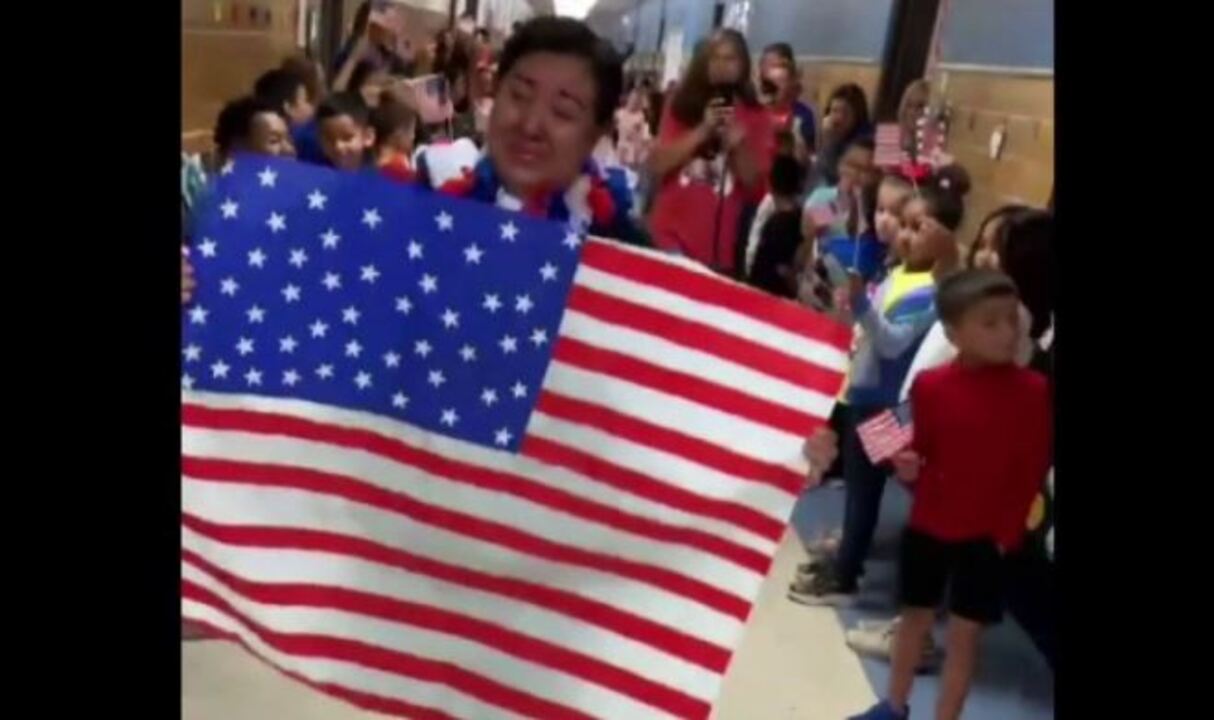 Students and teachers at Oliver Elementary School celebrate cafeteria worker Maria Ponce becoming an American citizen