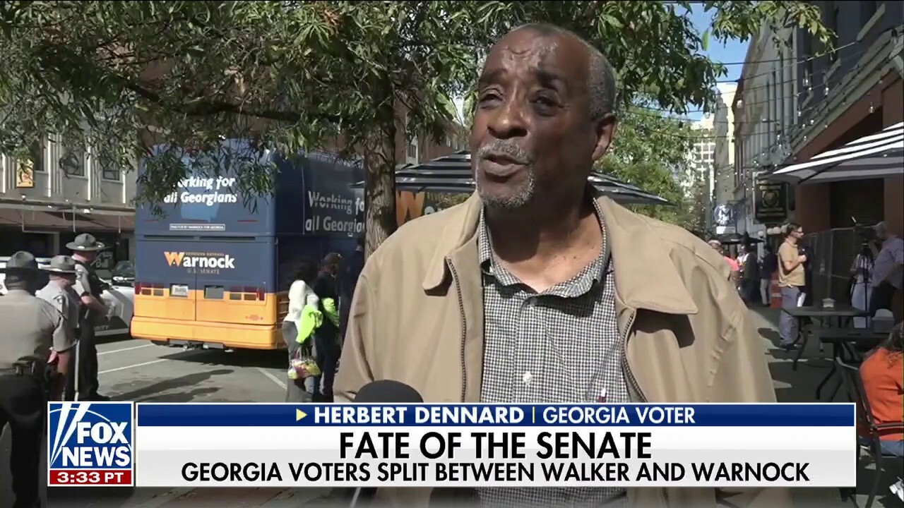 Georgia voters split between Walker and Warnock