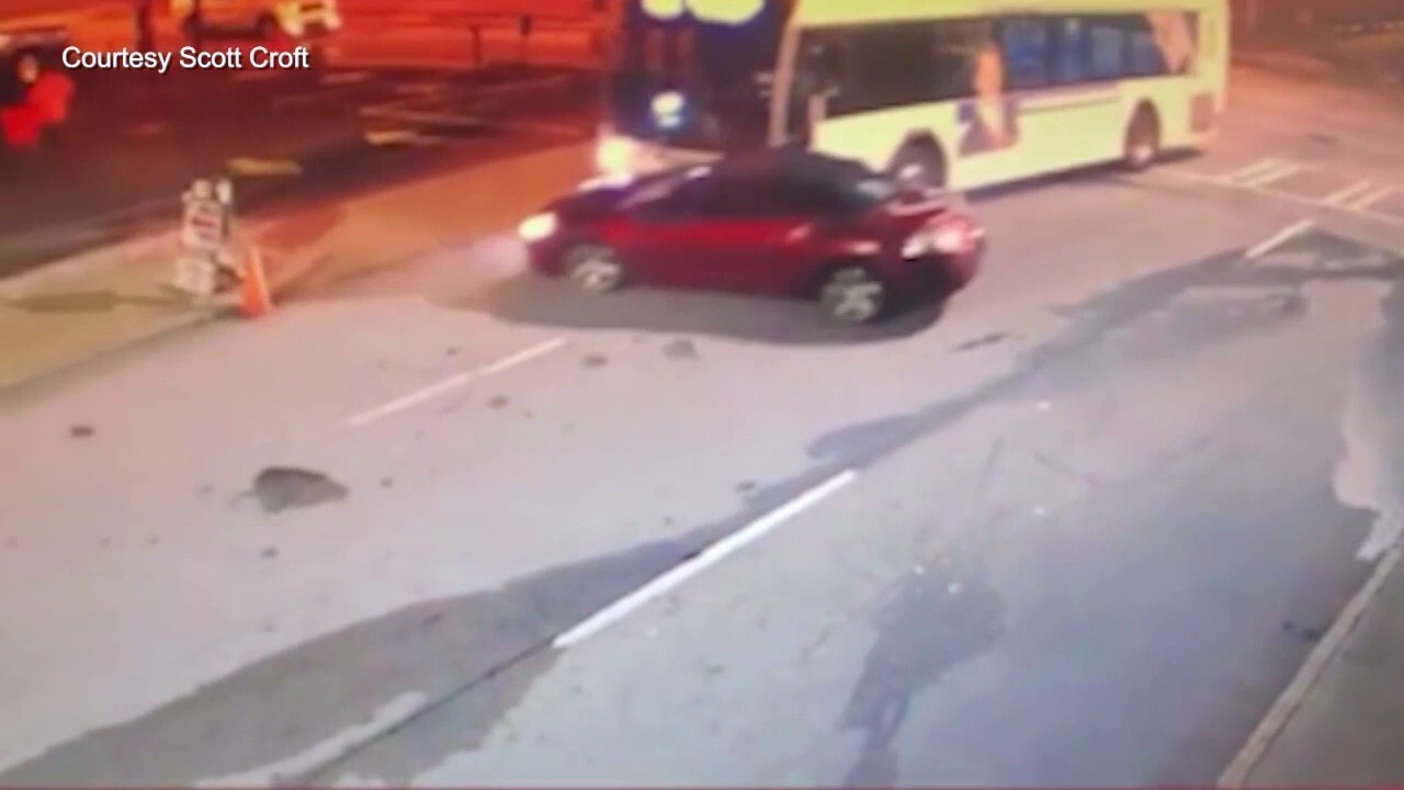 Atlanta bus slams into car, drags it along street