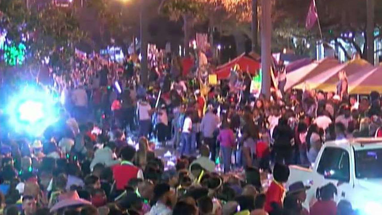 Car crashes into Mardi Gras crowd, injuring at least twelve