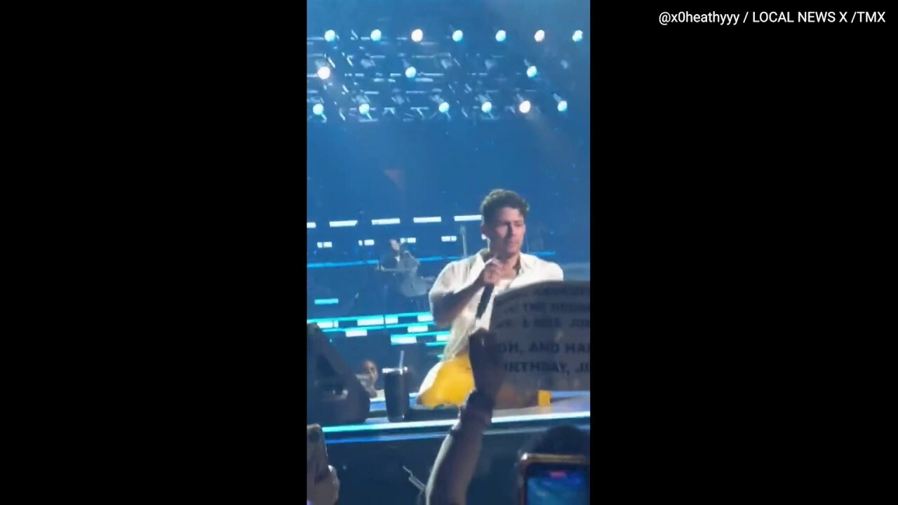 Nick Jonas falls into a hole on stage during Jonas Brothers concert