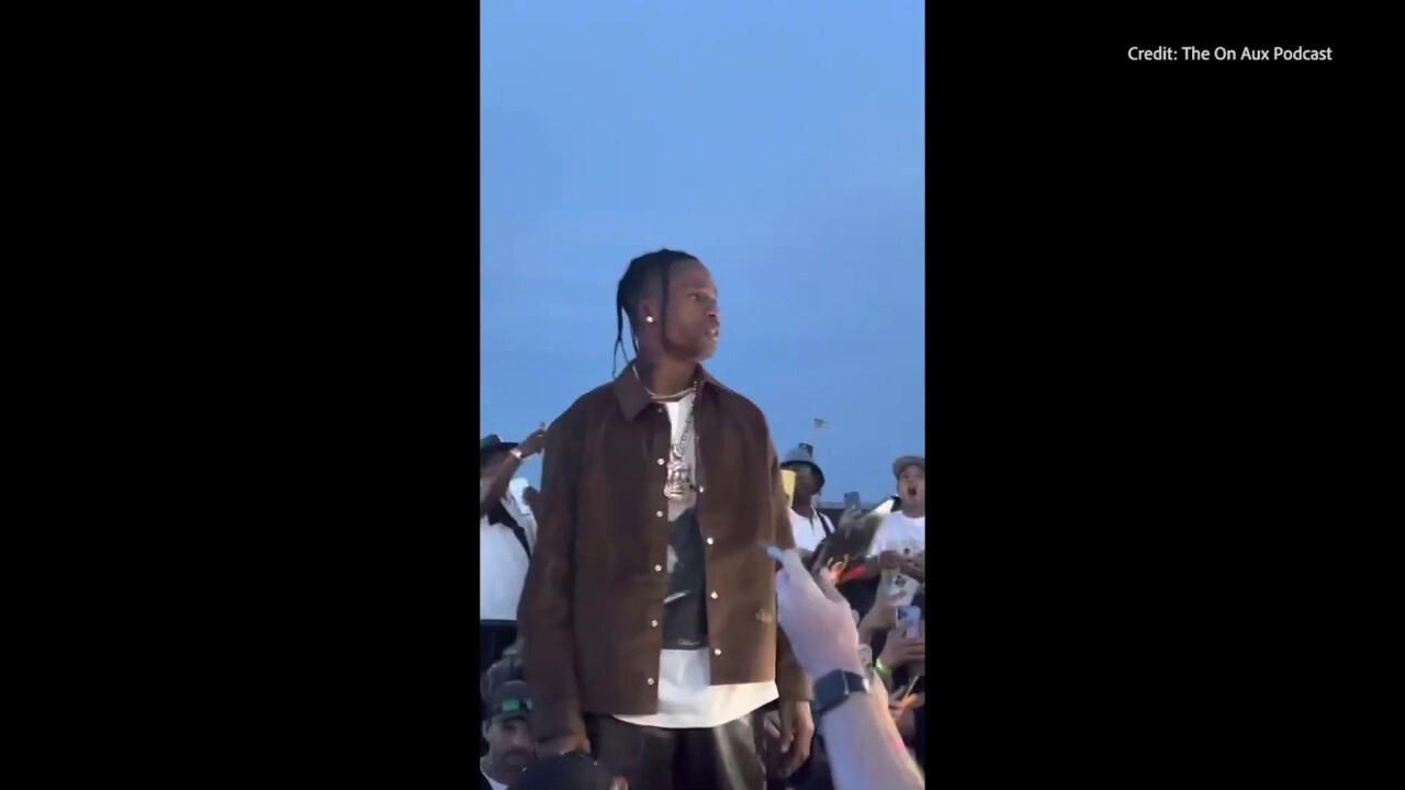 Travis Scott stops his concert to call out fans climbing equipment
