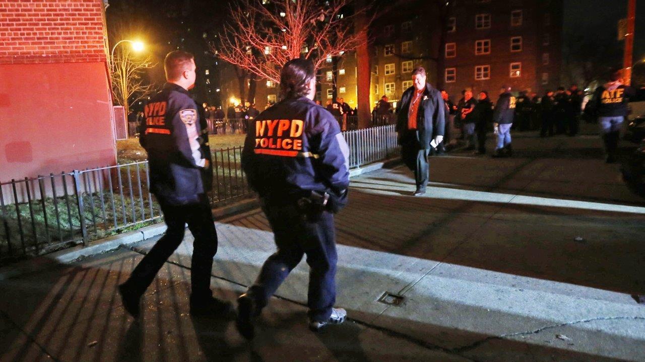 Investigators look for motive in shooting of two NYPD cops 