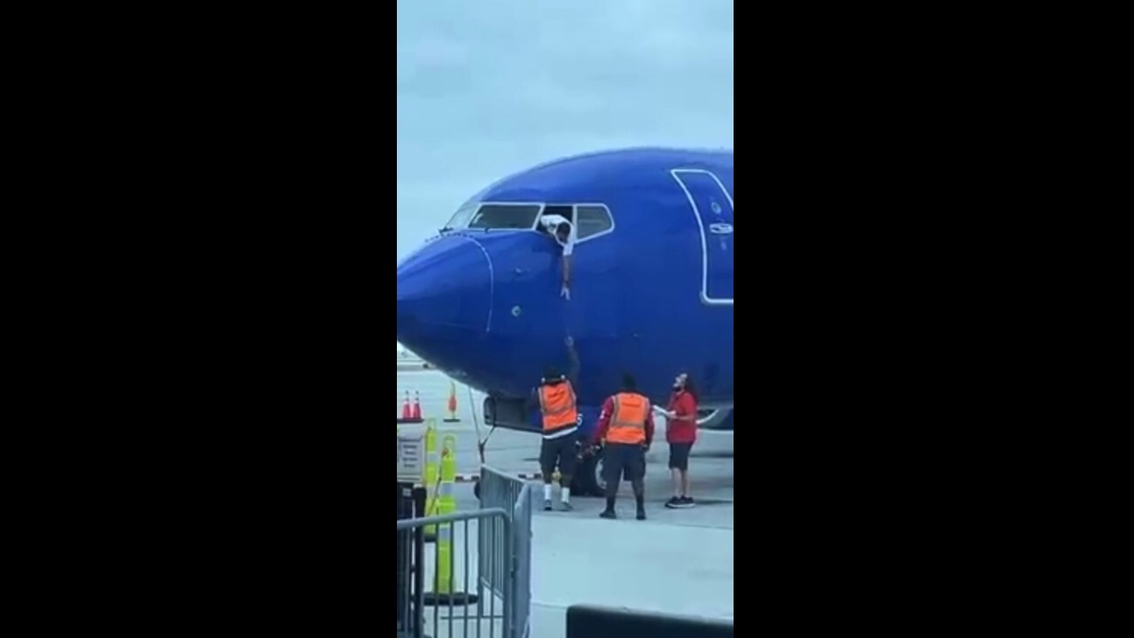 Southwest Airlines pilot hangs from window to retrieve passenger’s cell phone