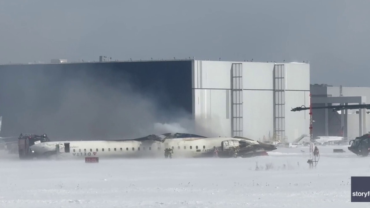 Footage from Mark Fitzpatrick shows the plane lying upside down and emergency services responding. (Mark Fitzpatrick via Storyful)