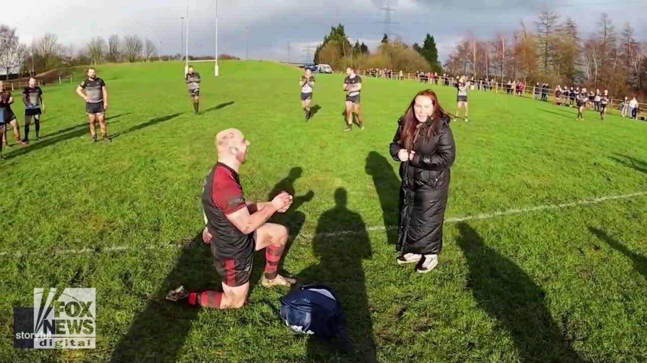 Game on! Rugby player fakes injury, then proposes: See the sweet video
