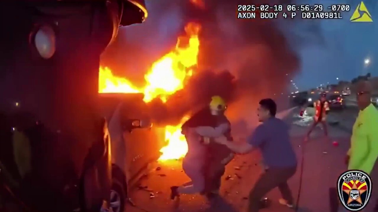 Dramatic bodycam footage shows woman rescued from fiery crash 