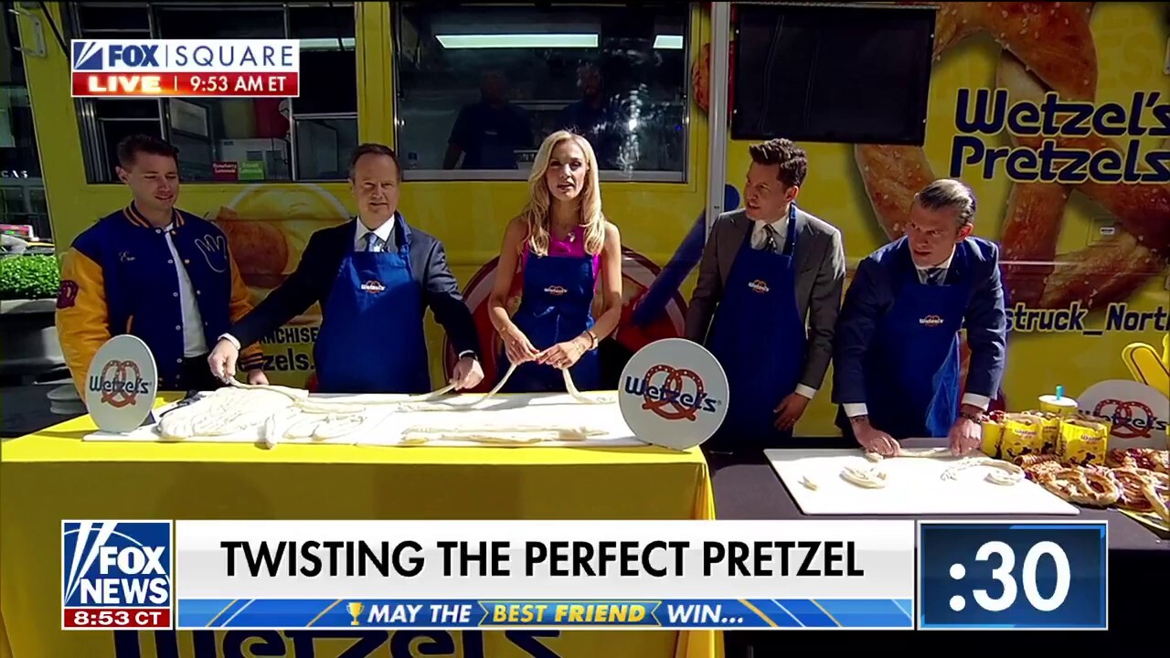 Project Manager for Wetzel's Pretzels Eric Cecil demonstrates how to twist a pretzel for National Soft Pretzel Month.
