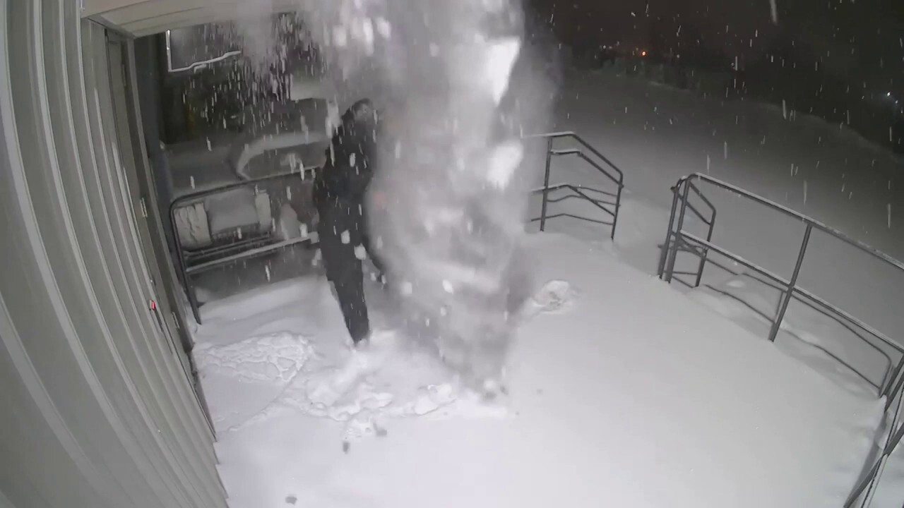 Wisconsin police officer gets snow dumped on him after closing door