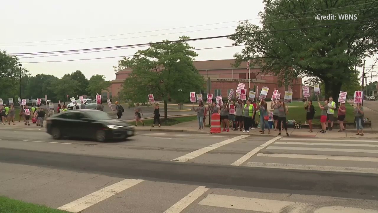 Ohio teachers union strike outside of a Columbus school following board proposal rejection