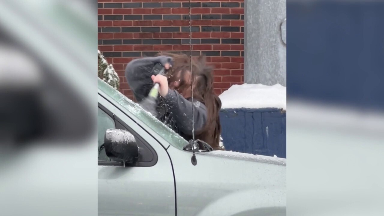 New Jersey woman aggressively scrapes ice off her car