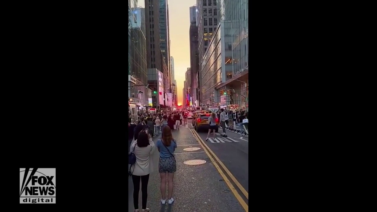 Sunset casts glow on New York City in stunning video