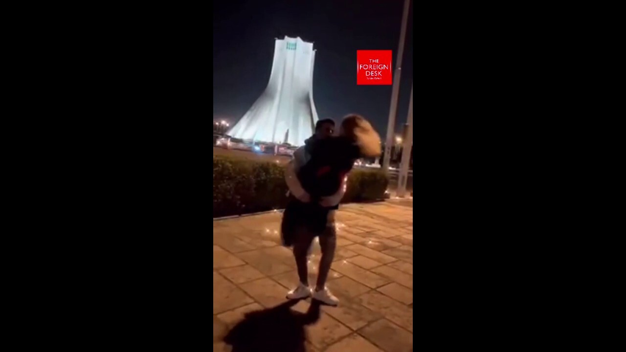Iranian couple dances in streets near "Freedom Tower"