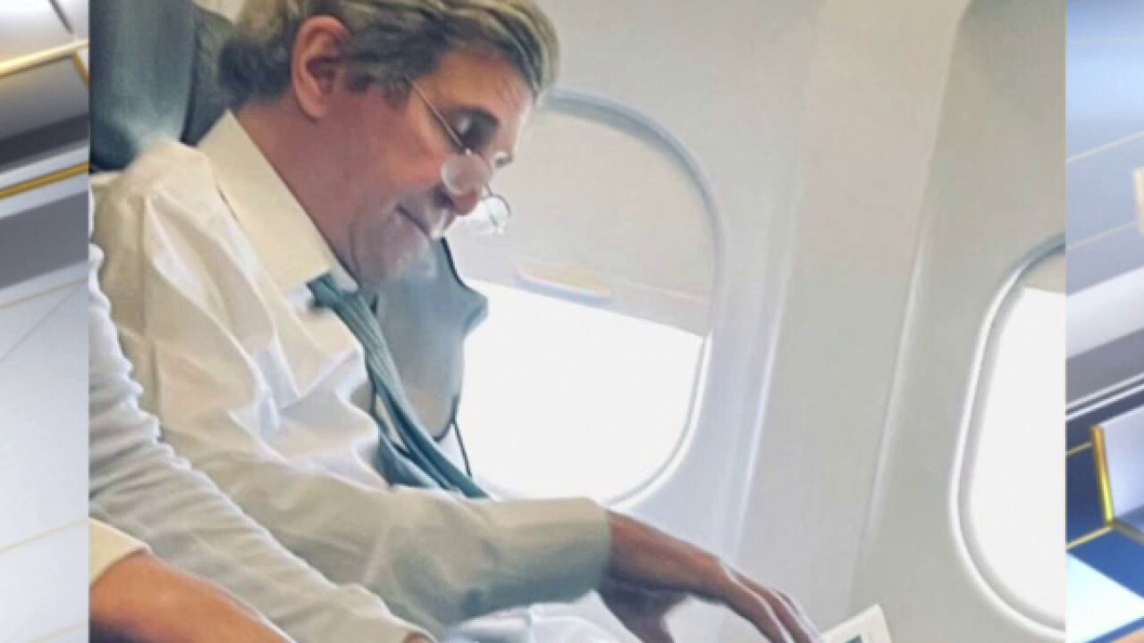 Climate czar John Kerry caught without mask on flight