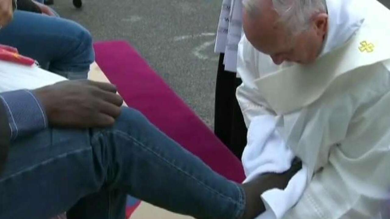 Pope washes refugees' feet during Holy Thursday tradition