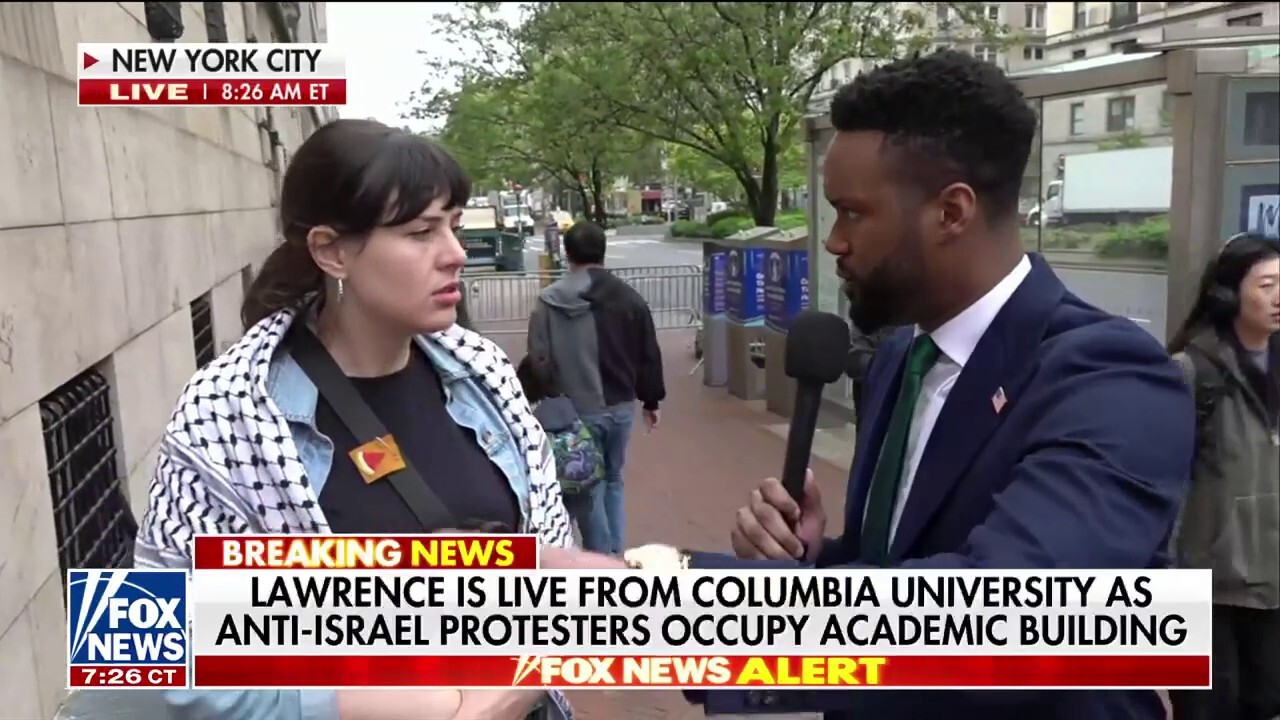 Fox News' Lawrence Jones talks to an anti-Israel protester near Columbia University in New York City. 