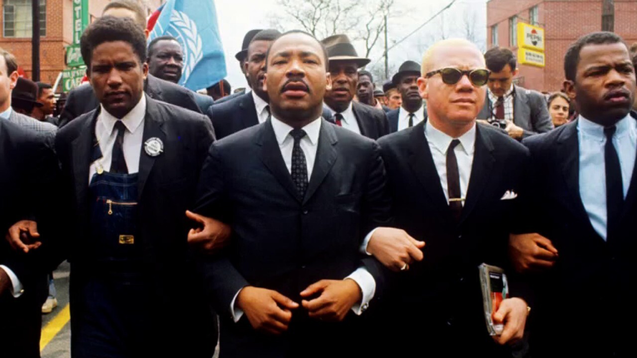 Photographer reflects on capturing key moments of civil rights movement with John Lewis