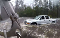Rescue Swimmer Investigates Truck in Dangerous Flooding