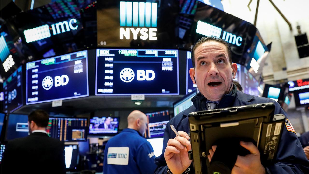 Markets close at records, after Dow dipped Monday