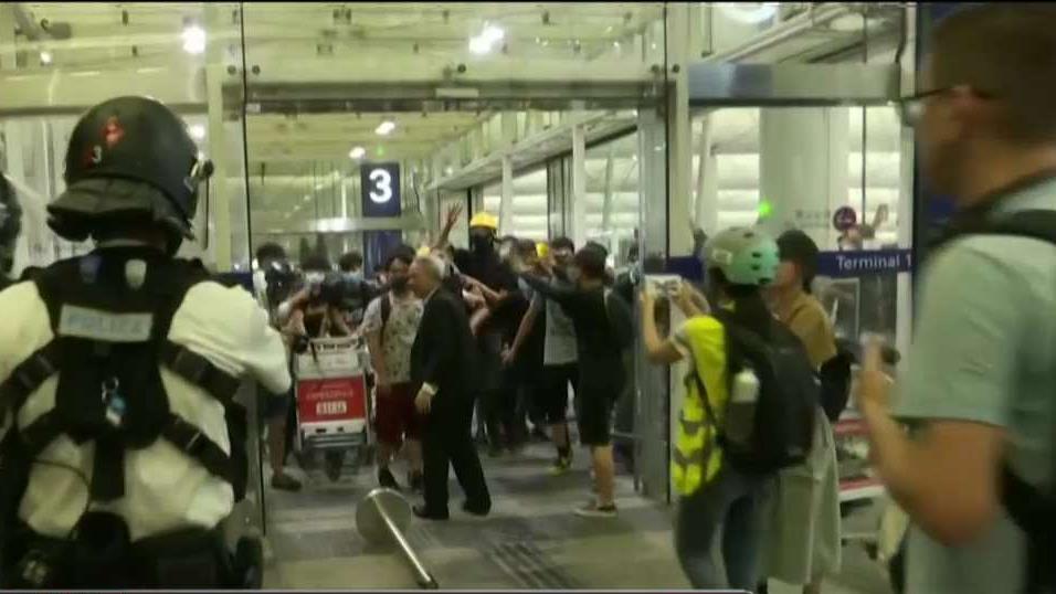 Protesters swarm Hong Kong airport