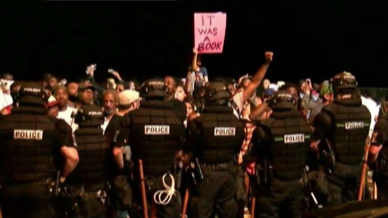 12 police officers injured in riots across Charlotte, NC