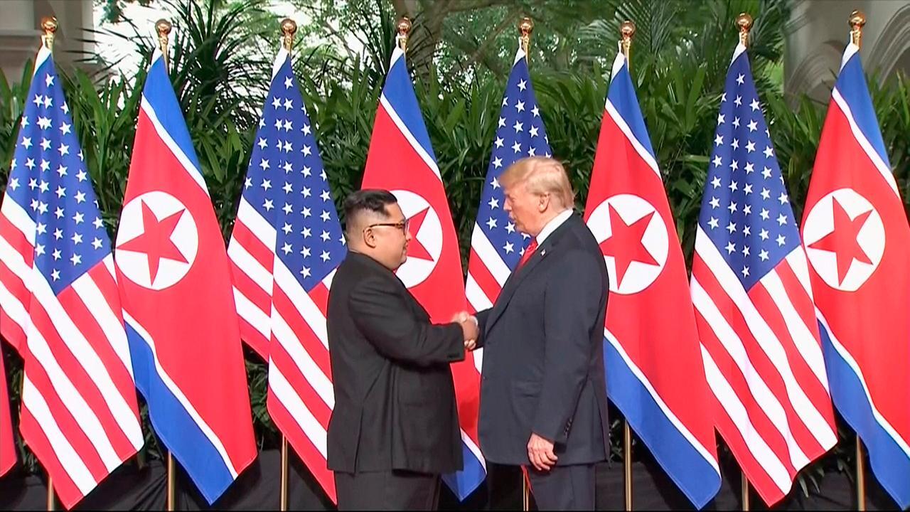 President Trump, Kim Jong Un greet each other at summit