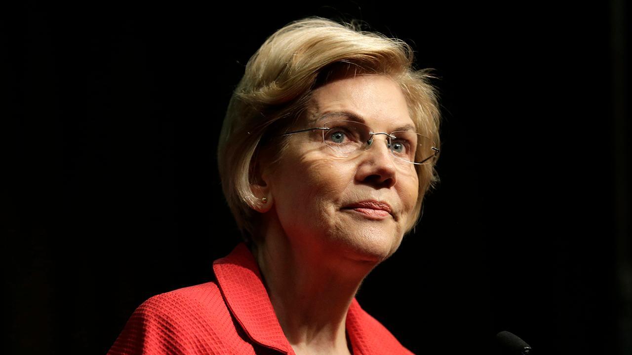 Elizabeth Warren accuses Wall Street of looting economy