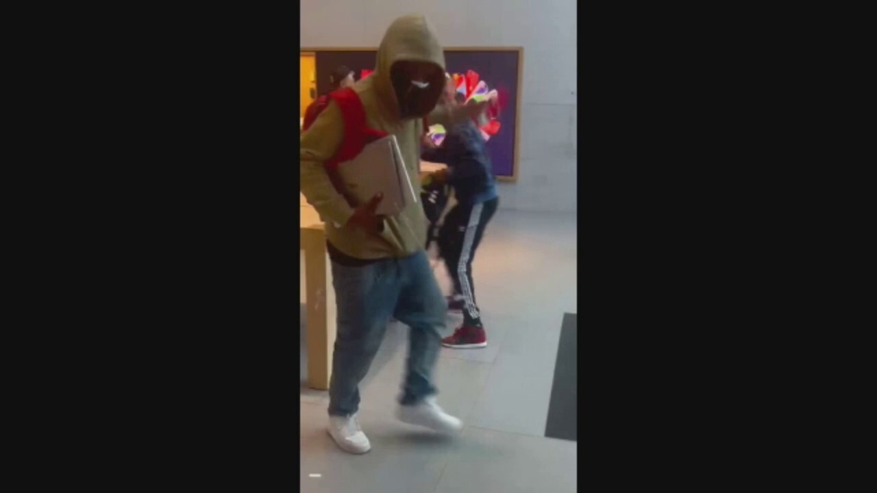 Two people are seen stealing iPhones and other merchandise from an Apple store in California on Black Friday (Credit: Instagram: @ppv_tahoe)