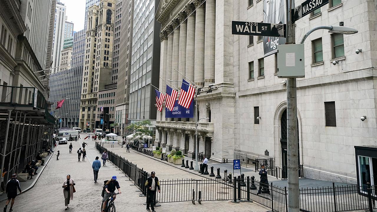 Dow hits record close due to optimism over COVID relief negotiations