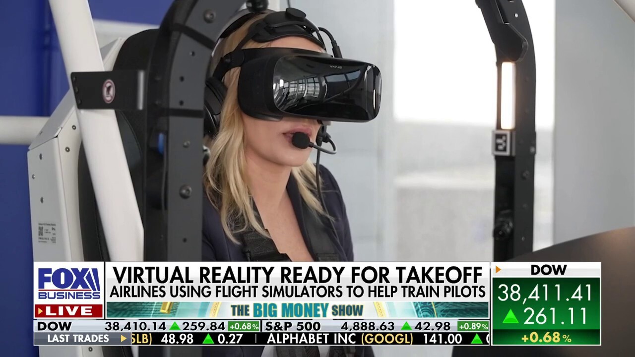 Kelly O'Grady tests out virtual reality flight simulator designed to help train pilots