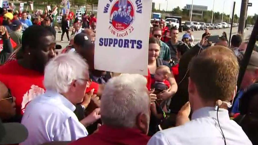 FOX Business' Grady Trimble shoved as he tried to ask Bernie Sanders a question at GM rally 