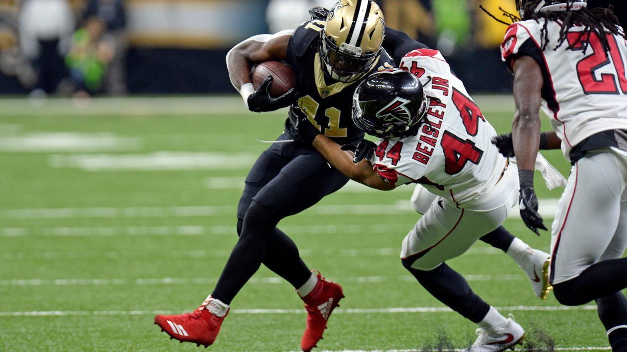 NFL fines Saints running back for wearing red cleats
