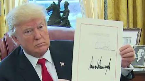 Trump signs tax bill