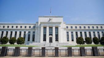 Federal Reserve raises interest rates by a quarter percentage point, sees two rate hikes next year