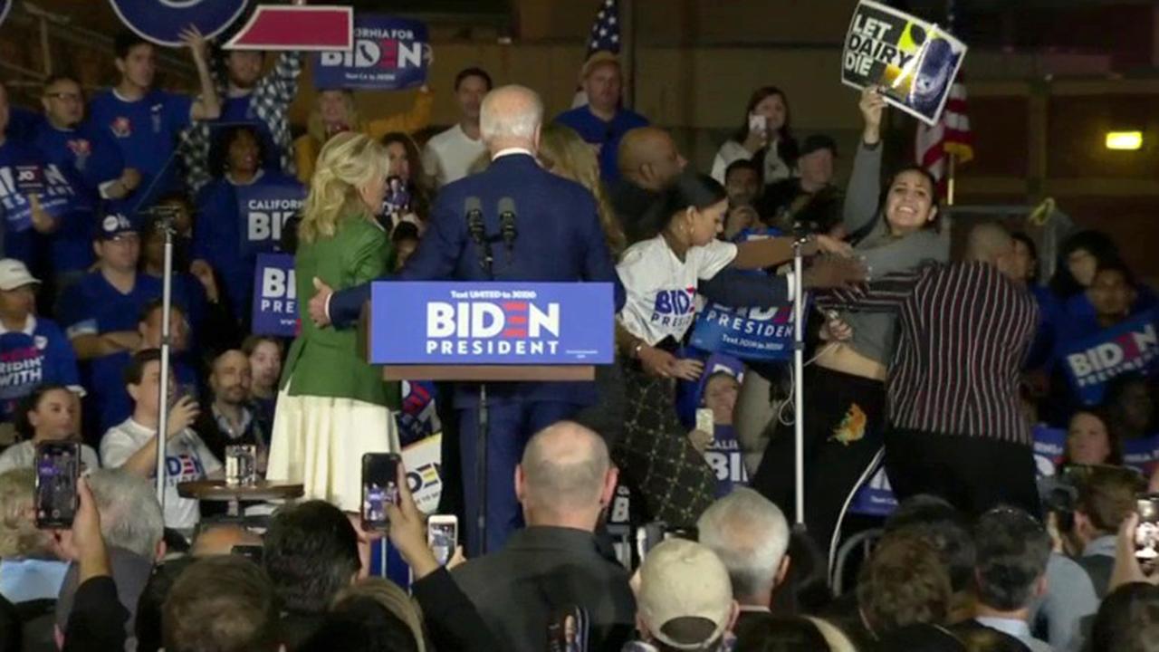 Anti-dairy protesters rush stage during Biden speech 