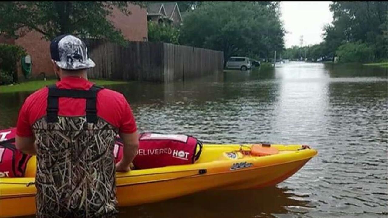 Delivering pizza by kayak to hungry Texans after Harvey