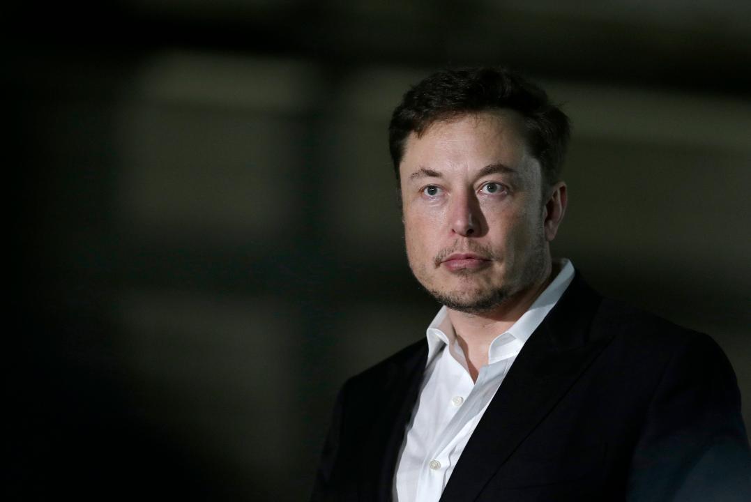 Tesla CEO Elon Musk touts robot cars amid sales slump