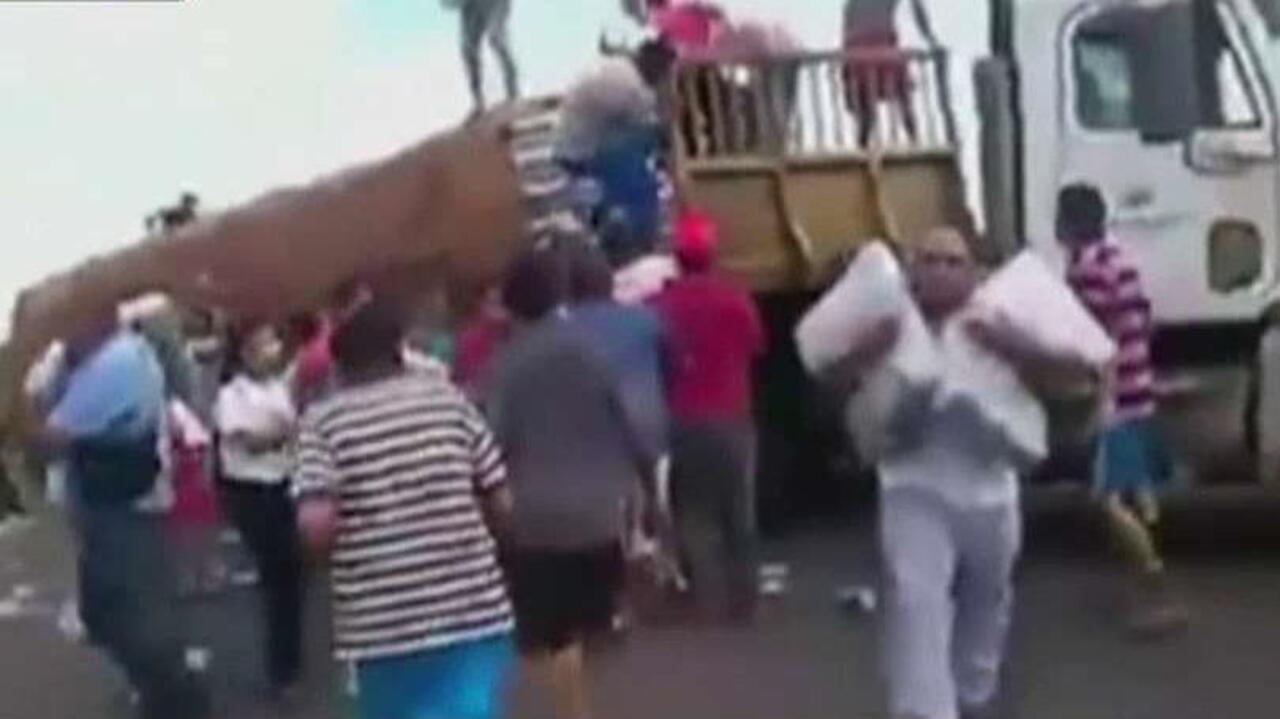 Exclusive: Graphic video shows Venezuelans looting, eating garbage