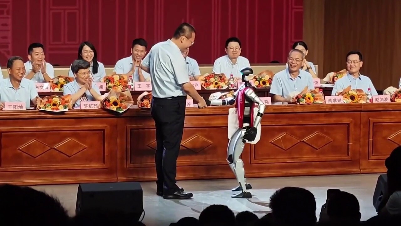 In this video taken by a bystander in the audience, a robot named Shuang Shuang joined teachers onstage at a Chinese high school graduation on July 1. Credit: ViralPress