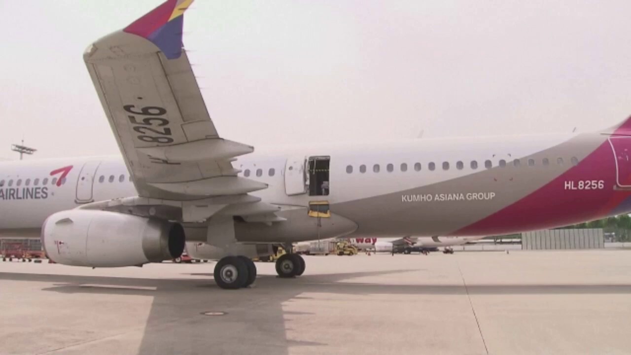 All passengers survive after man opens emergency door as Asiana Airlines plane lands in South Korea Friday. Some passengers received medical attention after fainting.